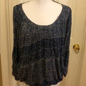 Free People blousy top. Fitted bottom.